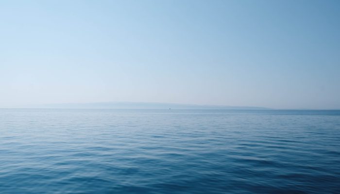 Body Of Water Under Blue And White Sky At Daytime